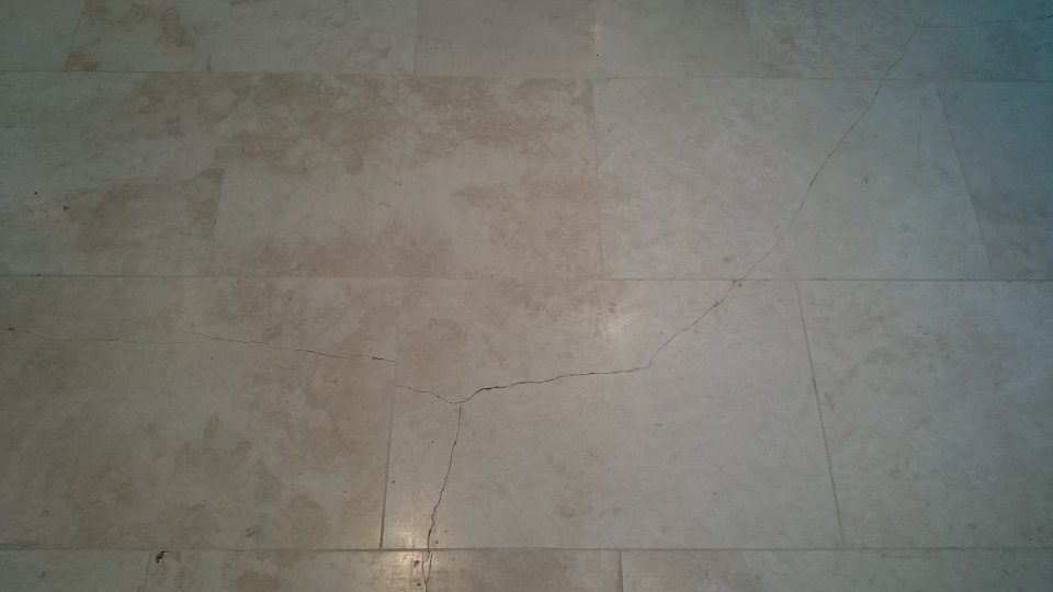 Numerous cracks in a Travertine Floor